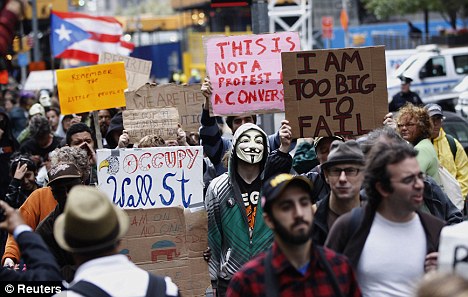 Anger: Hundreds of activists gathered a month ago in Manhattan and are still there, sparking a movement that is now spreading across the Atlantic